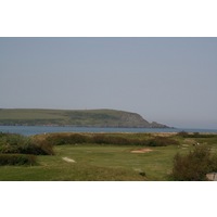 The par-3 11th hole on The Church Course at St. Enodoc Golf Club plays out toward the estuary. 