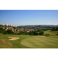 The ninth hole at Saint Etienne Golf Club is a short par 3 with a small green.