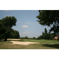 The par-4 17th hole is a sharp, tight dogleg at Golf du Gouverneur's Montaplan course. 