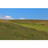 The difficult 17th hole at County Sligo Golf Club climbs uphill around a dogleg to the left. 