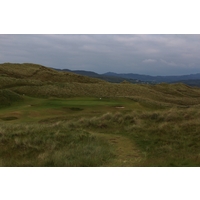 Dunes surround the par-3 14th hole on the Old Tom Morris links at Rosapenna Hotel & Golf Resort.