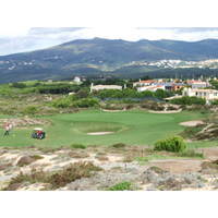 Bunkers and mountain views frame the green at Oitavos Golf Club's No. 3.