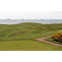 Helicopters regularly fly over Murcar Links Golf Club, transporting workers to the oil freighters off shore.