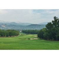The fourth hole of the Le Chateau golf course at Terre Blanche bends right while falling downhill.