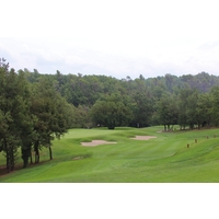 Golfers who carry the two fairway bunkers will have a wedge into the first green on the Le Riou golf course at Terre Blanche in France.