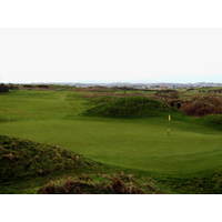 A pair of dunes protect the fourth green at Royal Portrush.
